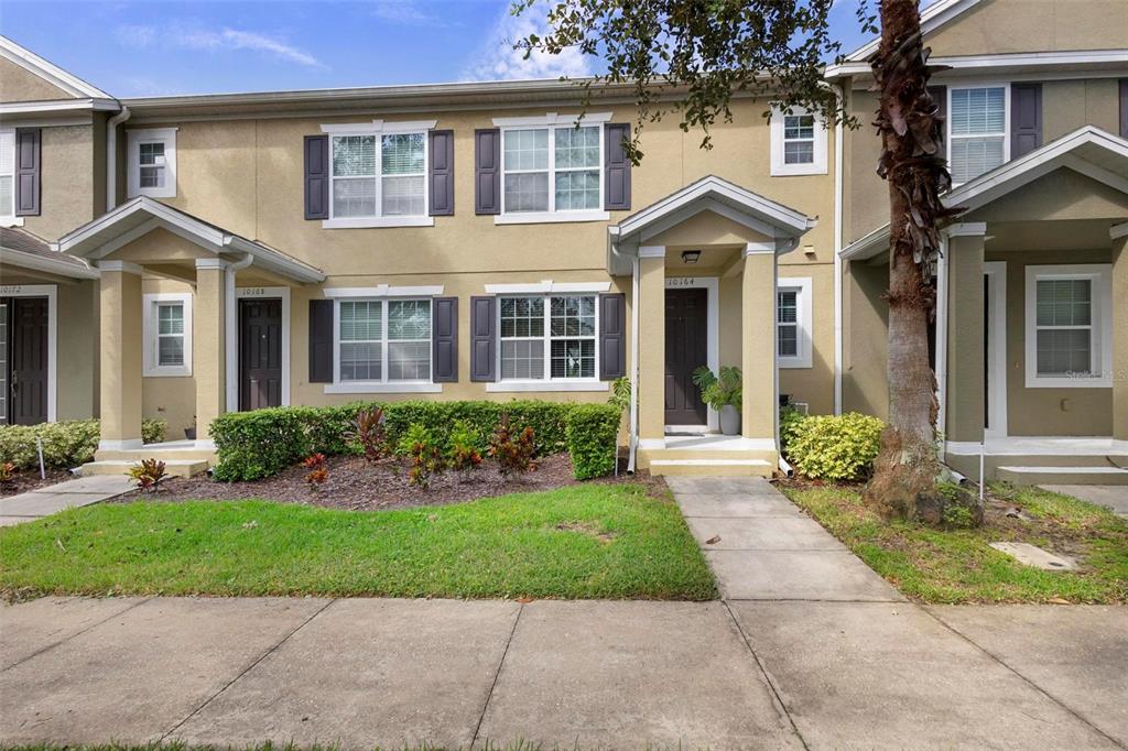 front view of a house next to a yard