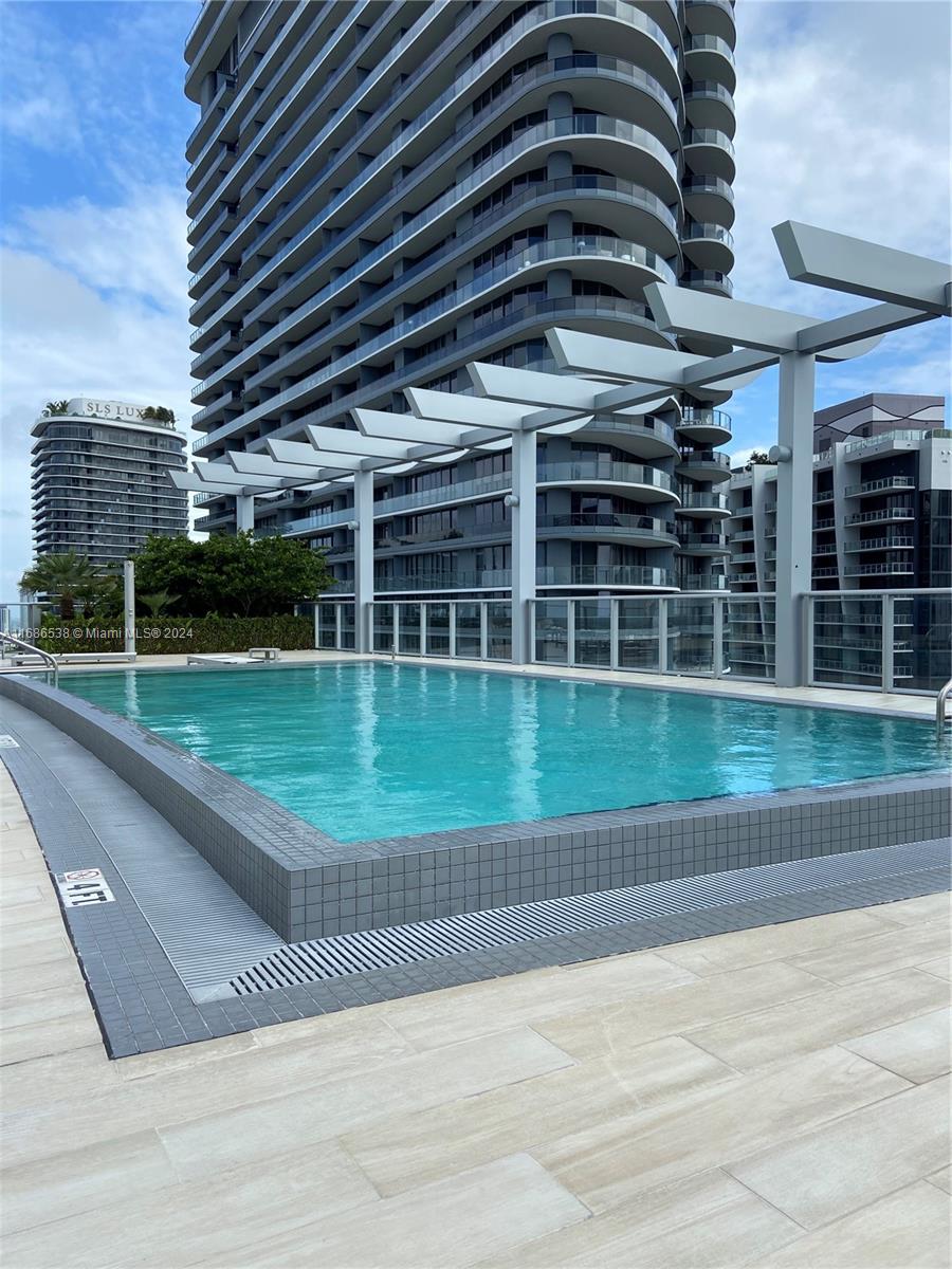 a view of a swimming pool with a garden