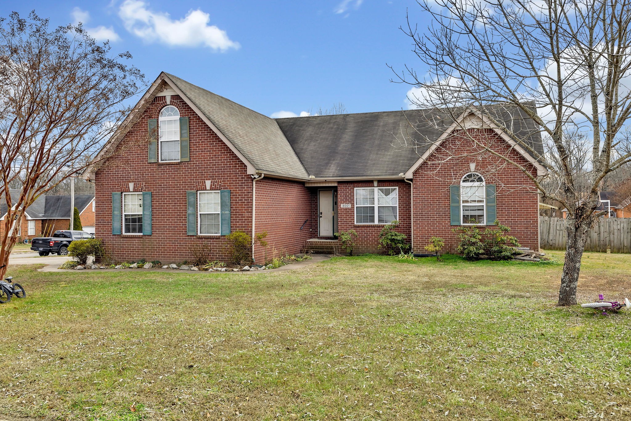 a front view of a house with a yard