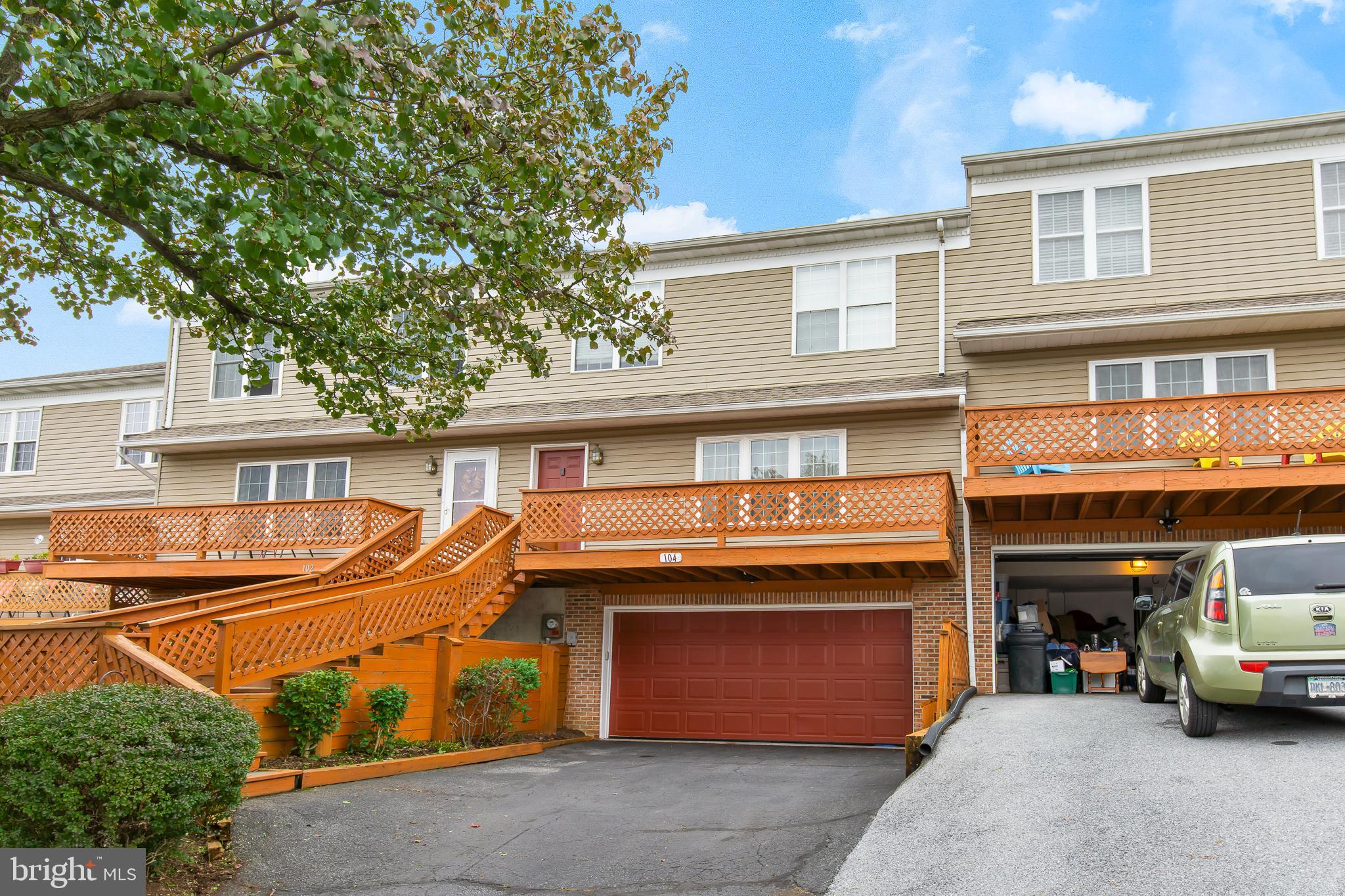 a front view of a house with parking space