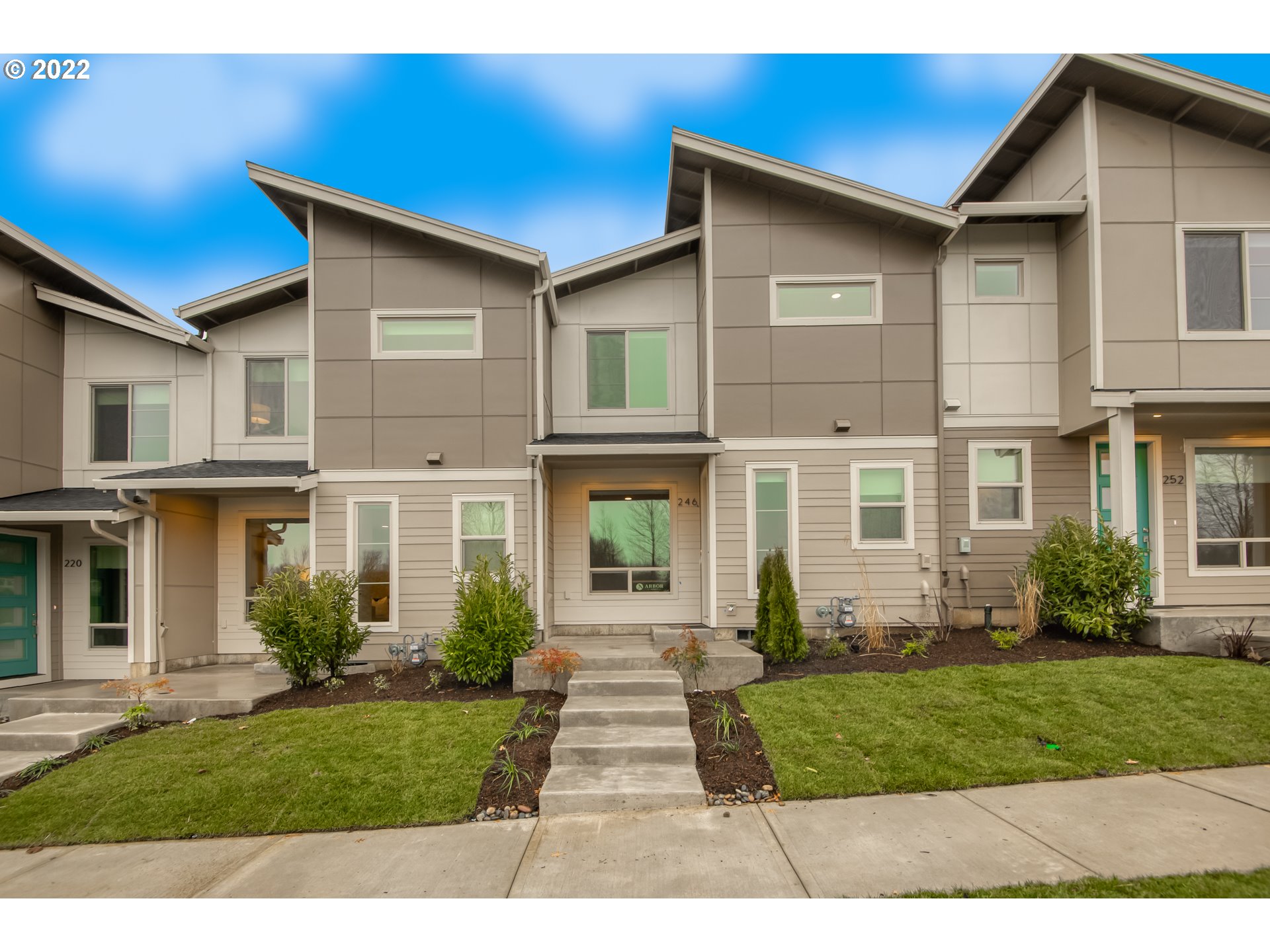 a front view of a house with a yard