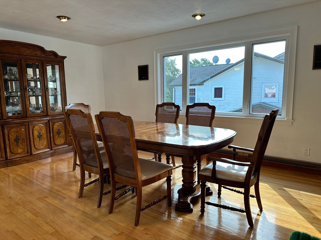 a dining room with furniture and window