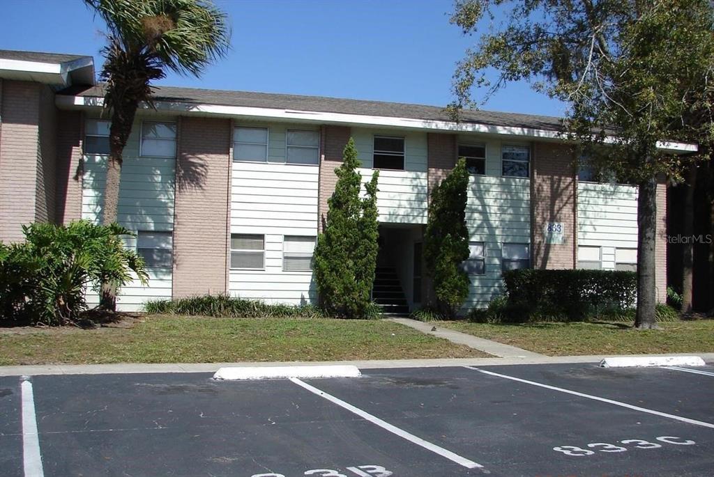 a view of a house with a yard