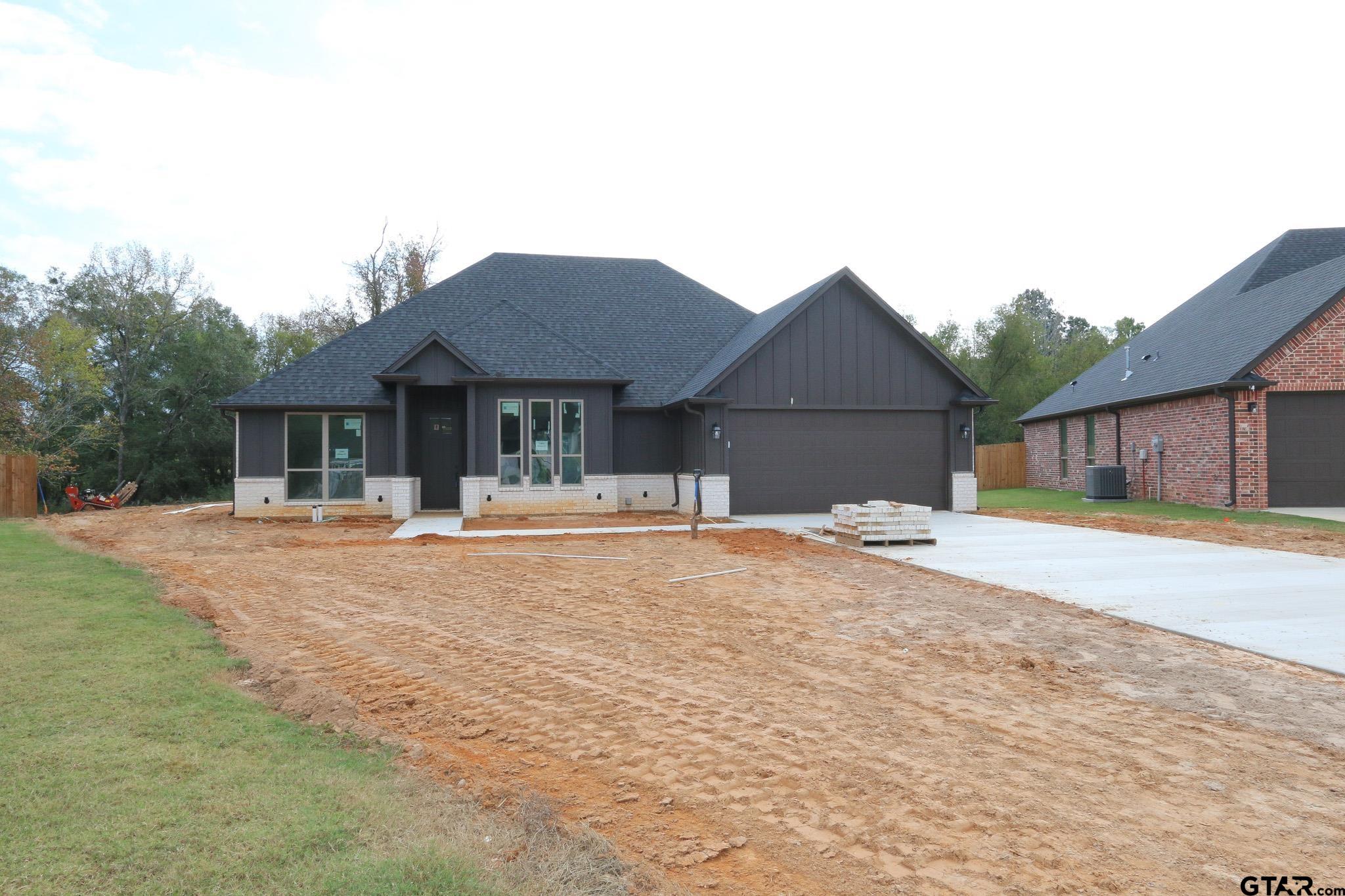 a house view with swimming pool in front of it