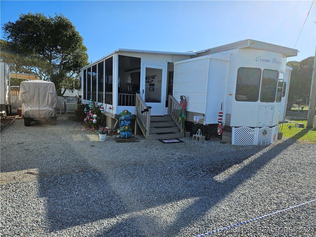 a view of a house with backyard and couches