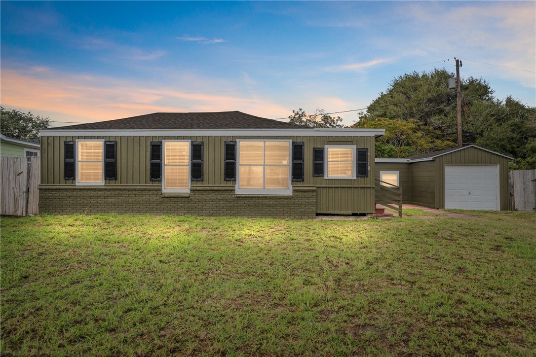 front view of a house with a yard