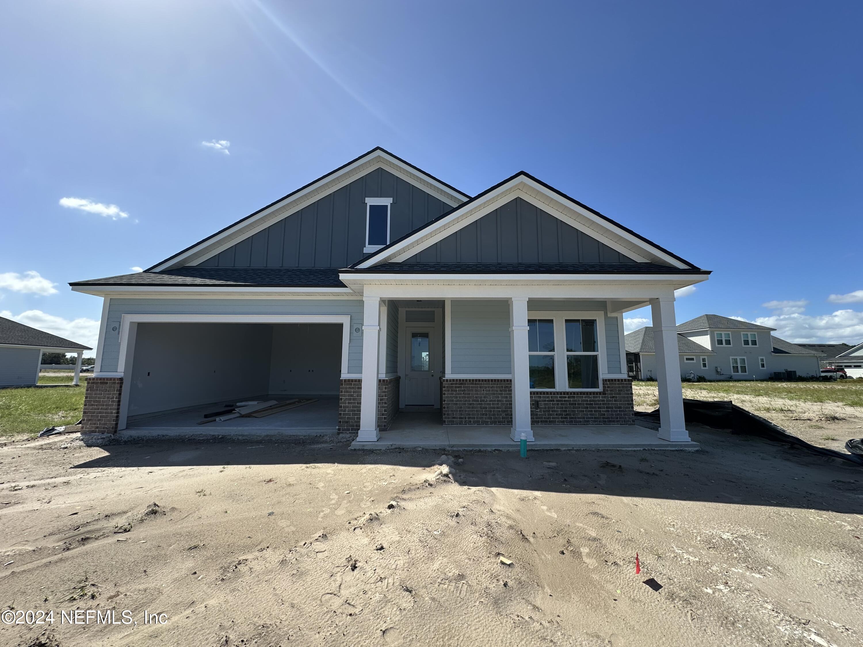 a front view of a house with yard