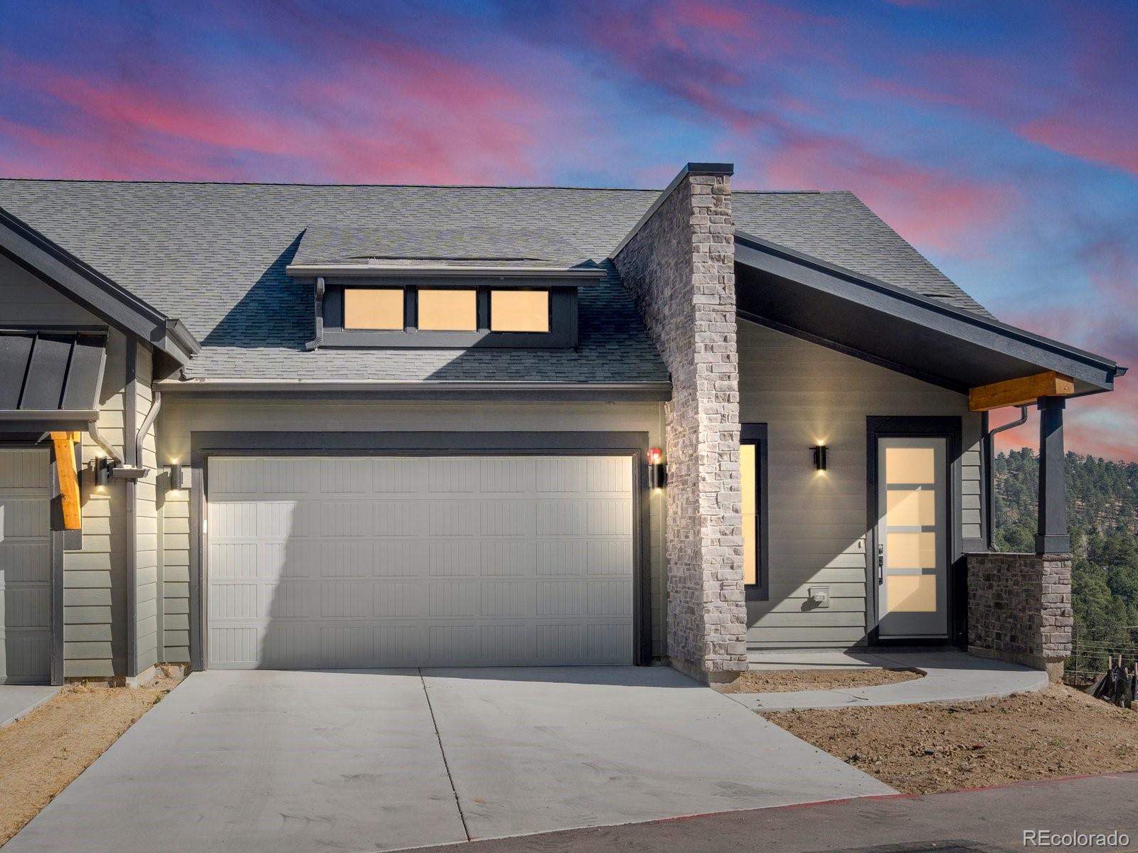 a front view of a house with a garage