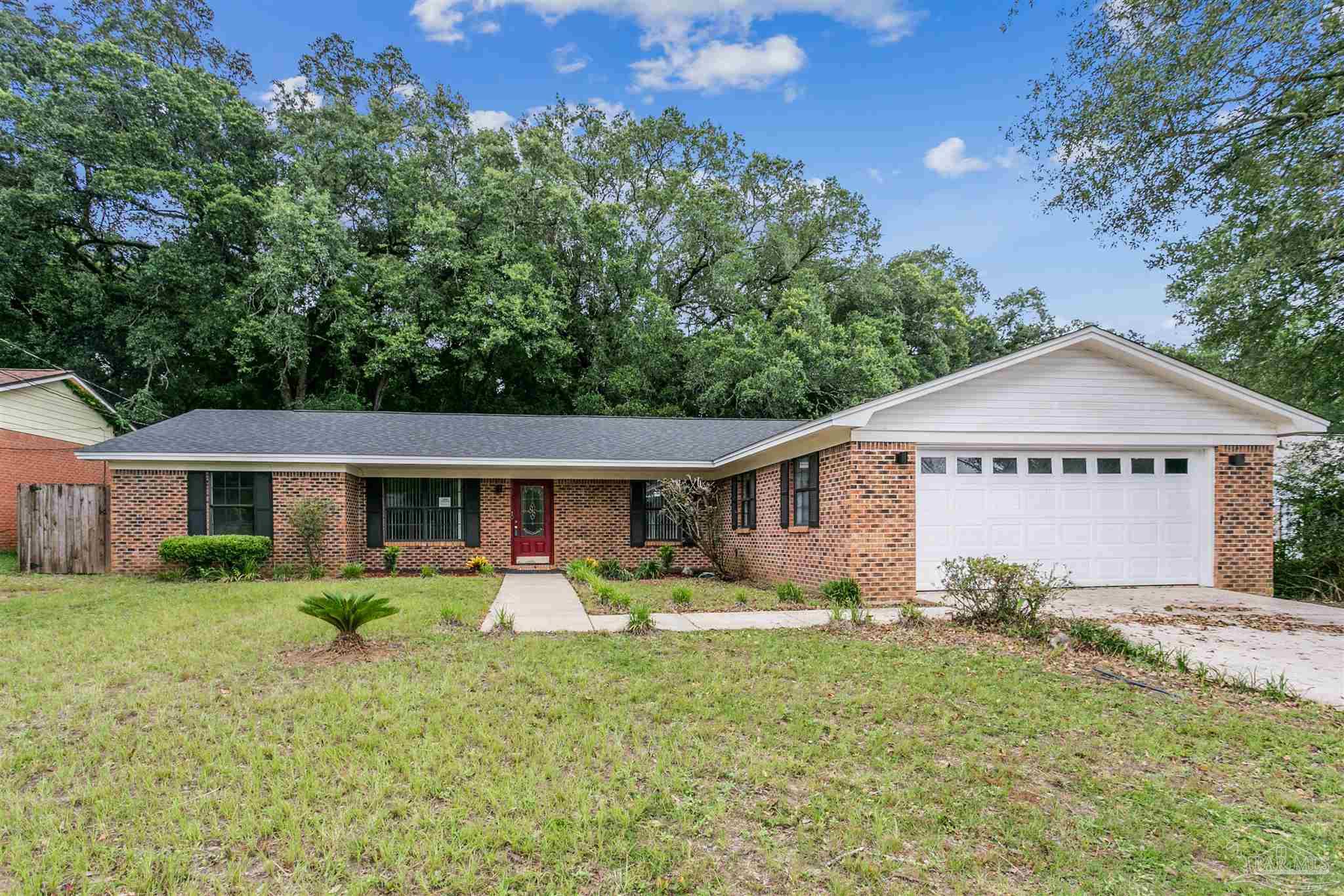 front view of a house with a yard