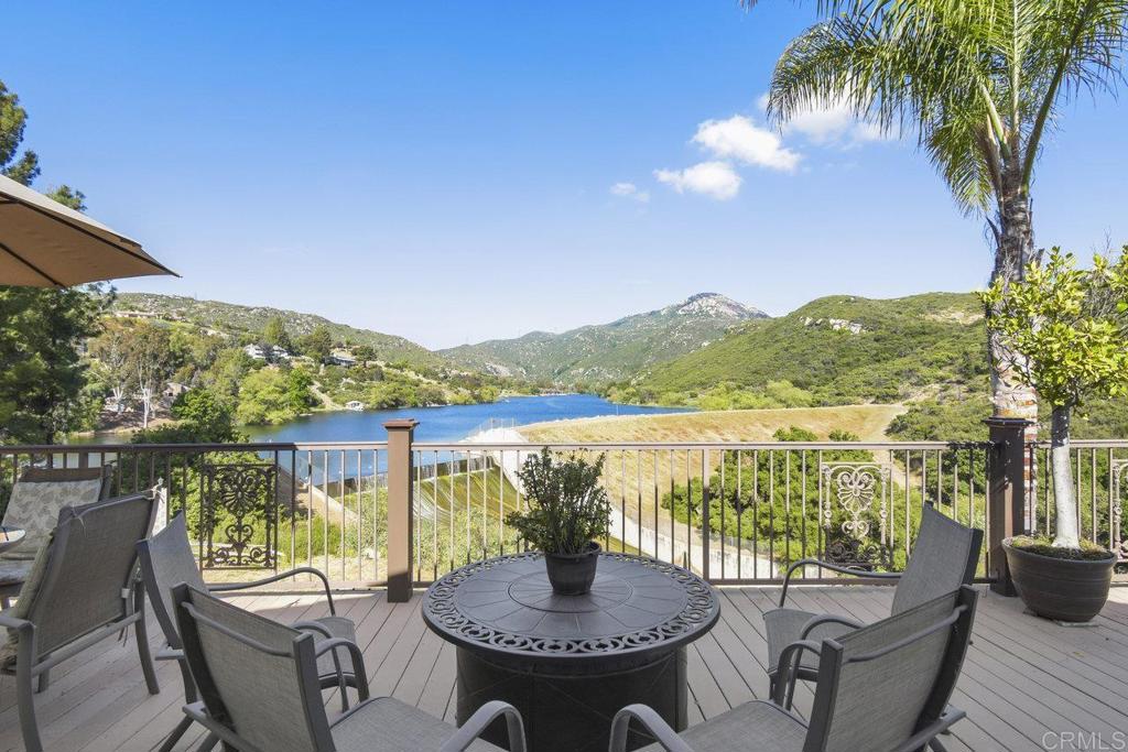 a view of a balcony with lake view and mountain view