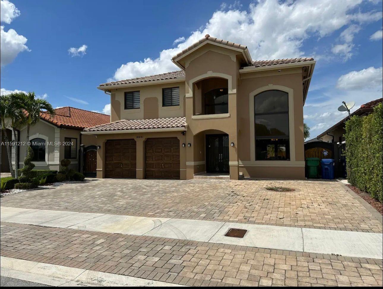 a front view of a house with yard