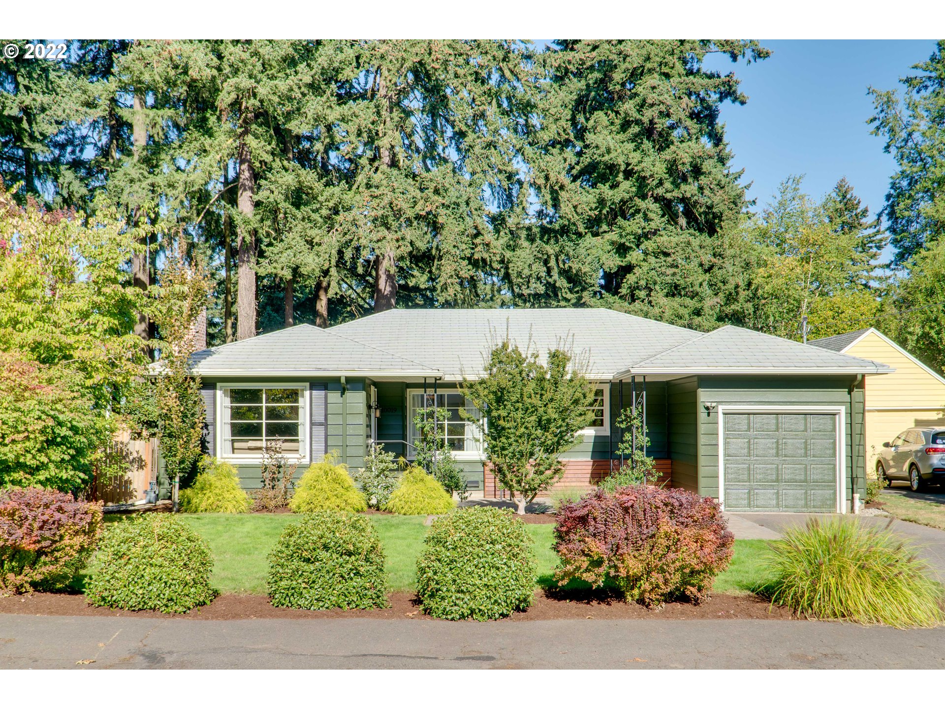 front view of a house with a yard