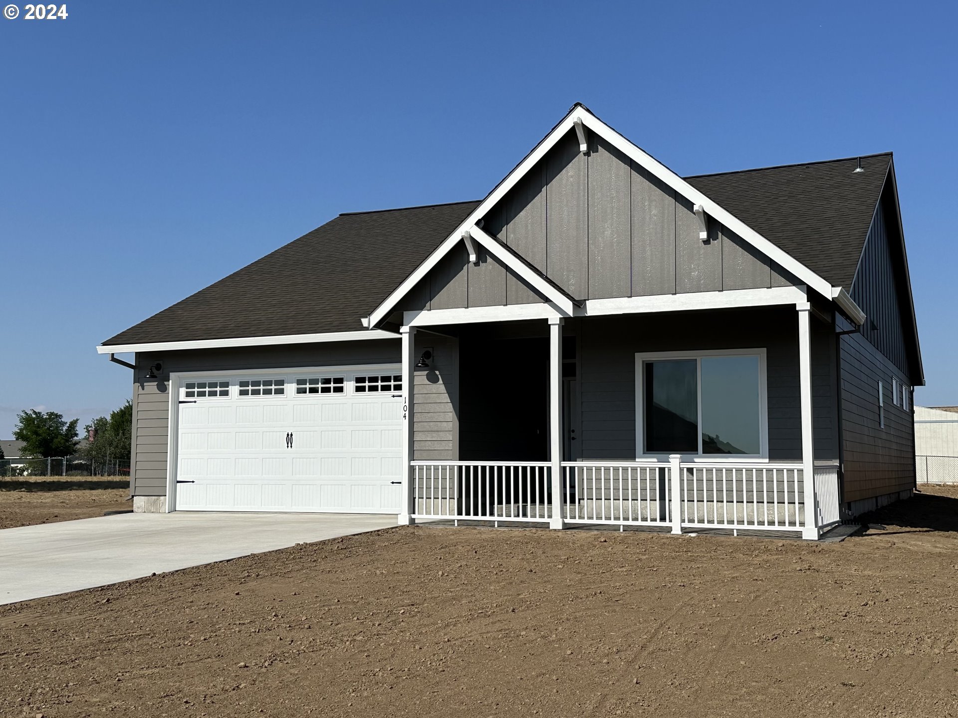 a front view of a house with a garage