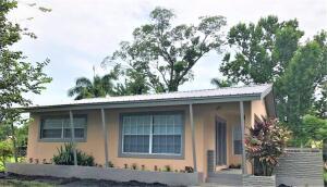 a house with a tree in front of it