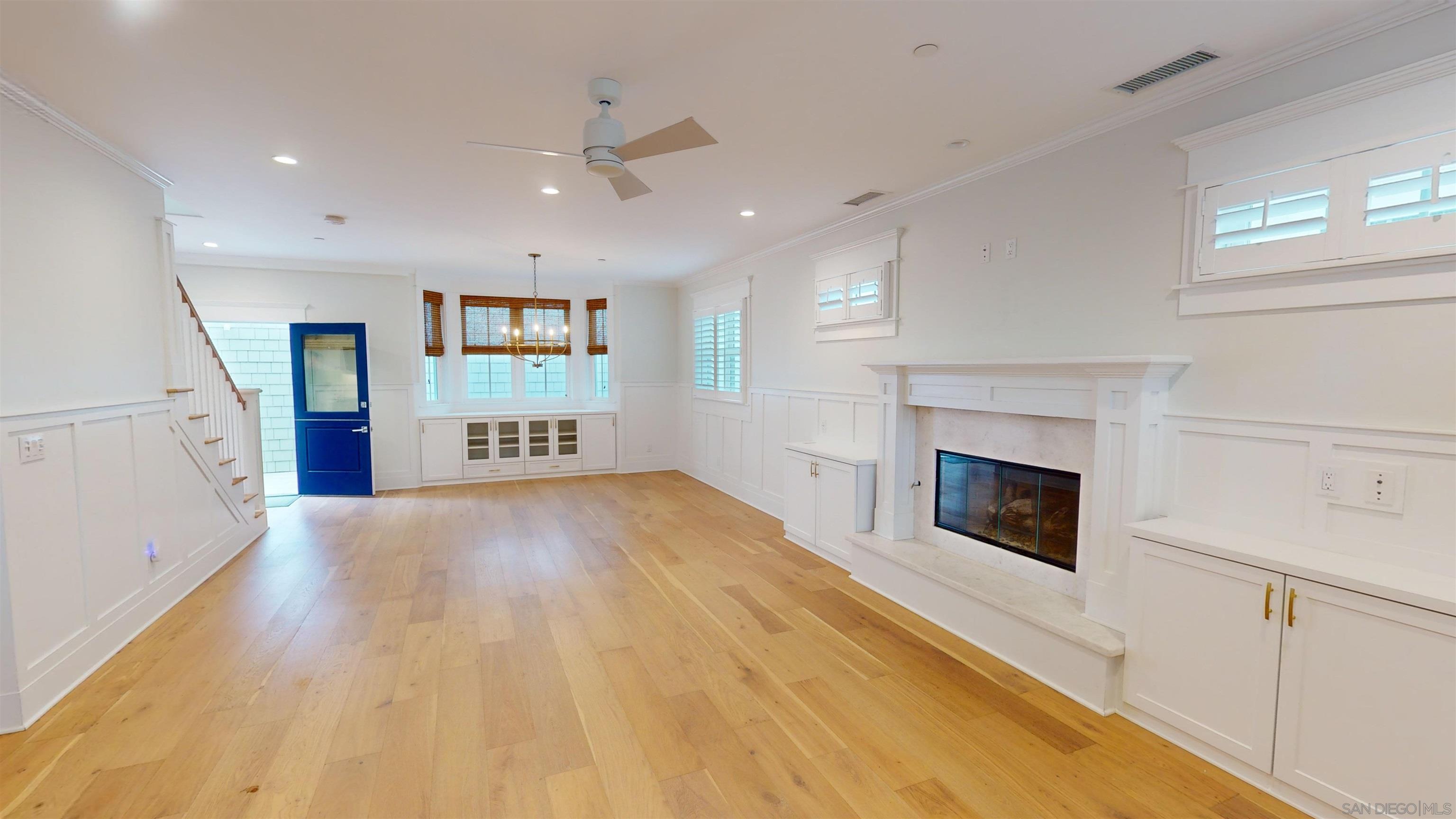 a view of an empty room and fire place