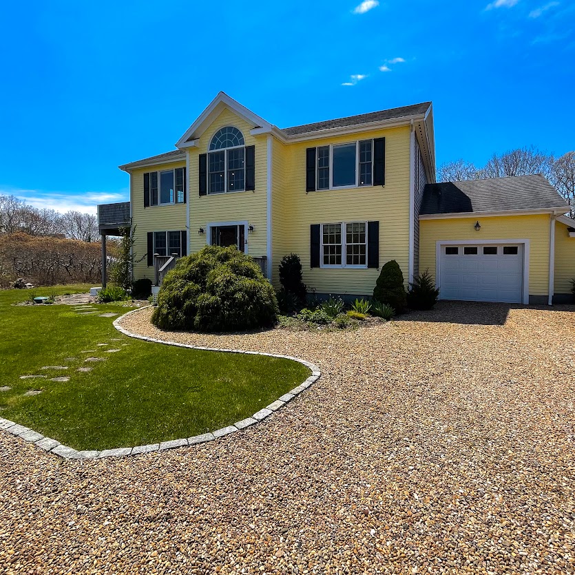 a front view of a house with a yard