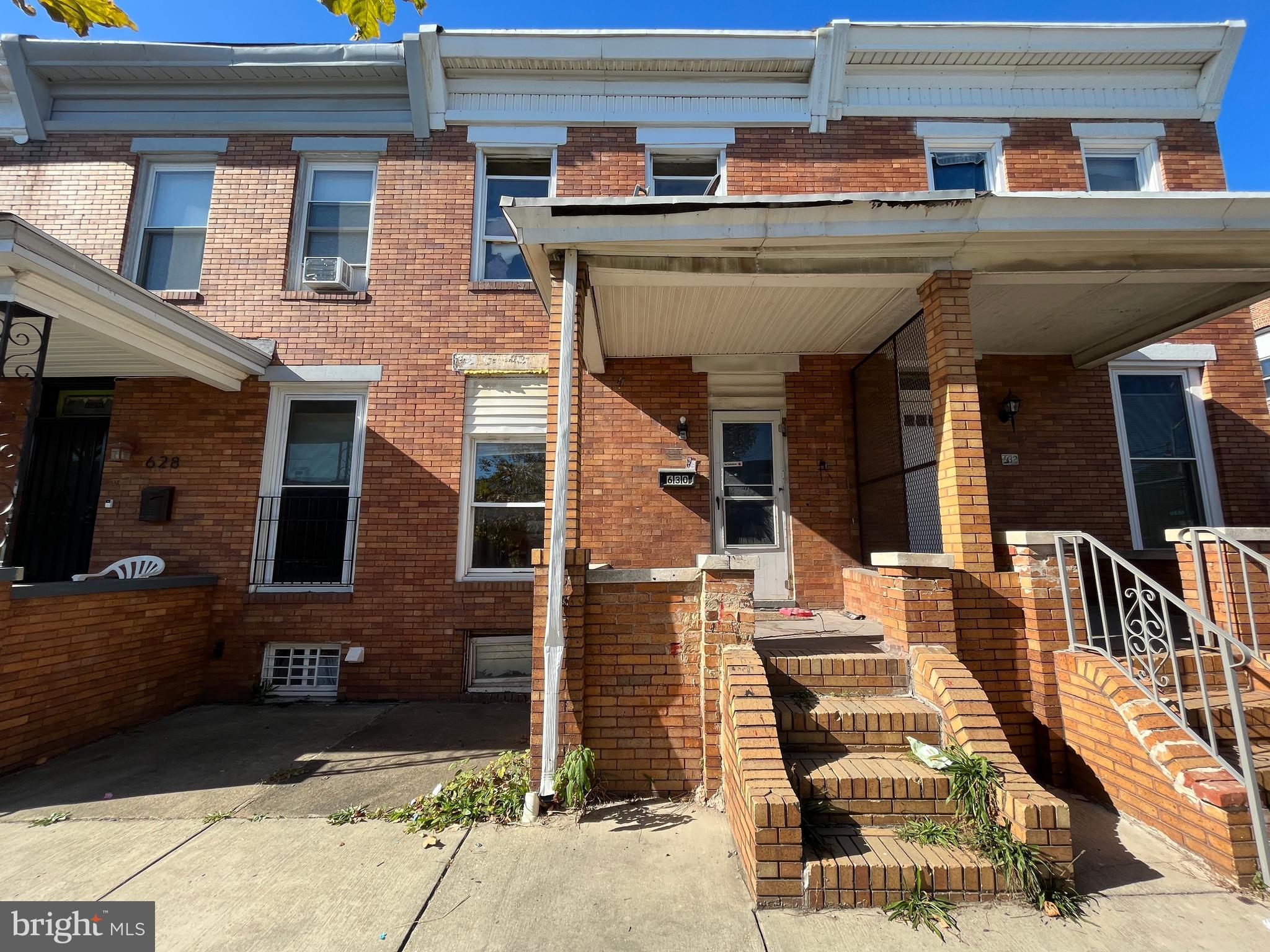 a front view of a house with a porch