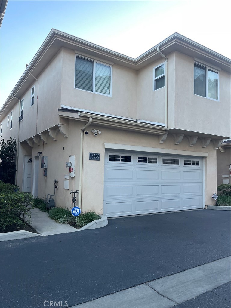 a front view of a house with garage