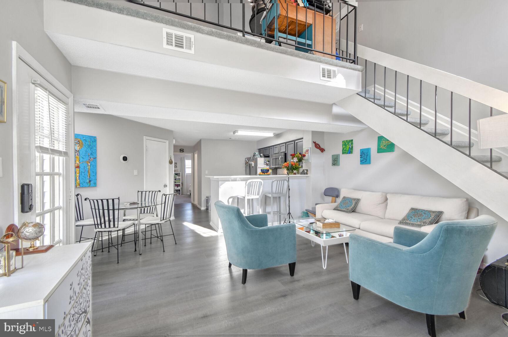 a living room with furniture and a table