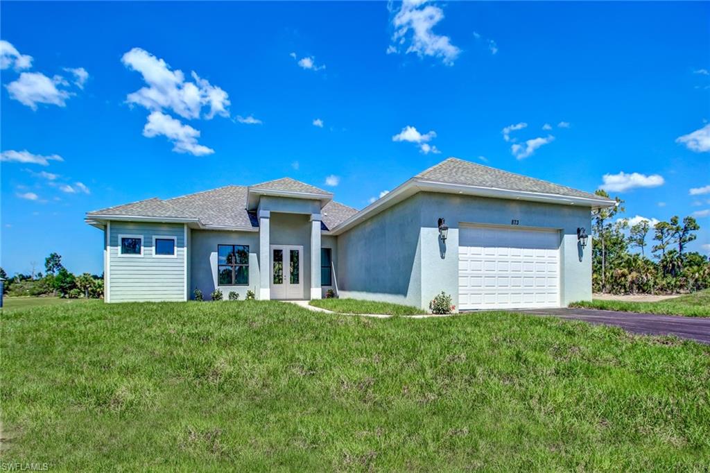 a view of a house with a yard