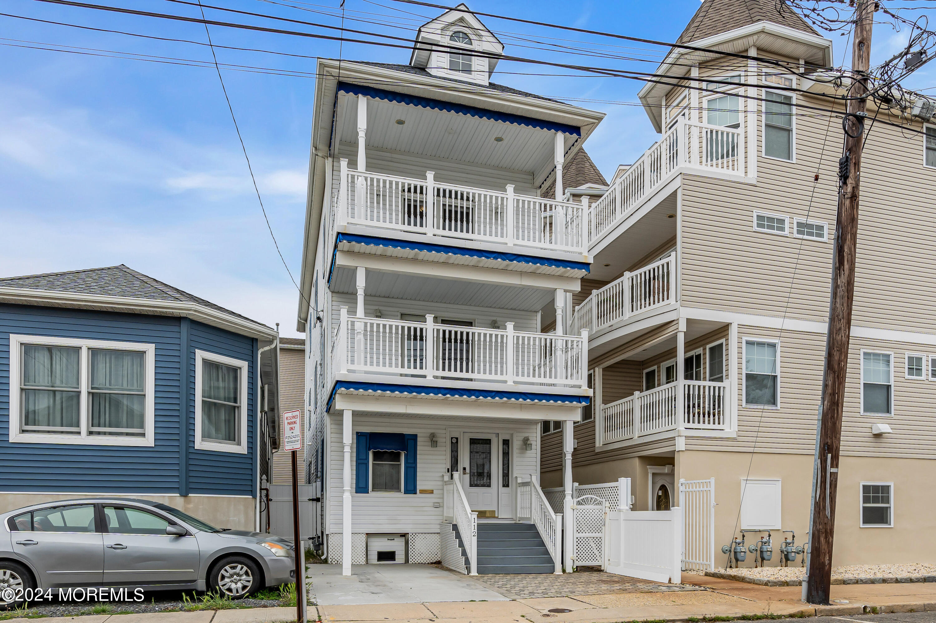 a front view of a residential apartment building with a yard