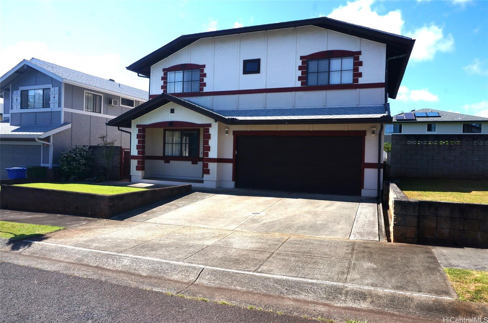 a front view of a house with yard