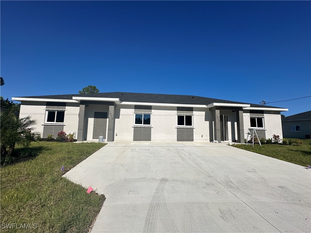 front view of a house with a yard