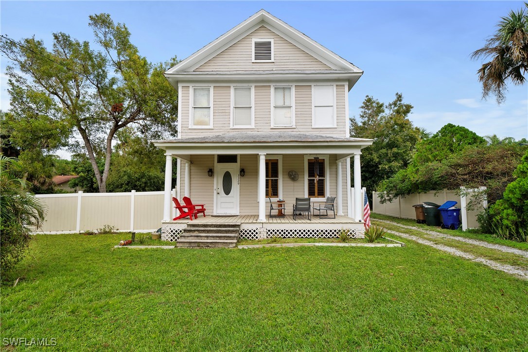 a front view of house with yard and outdoor seating