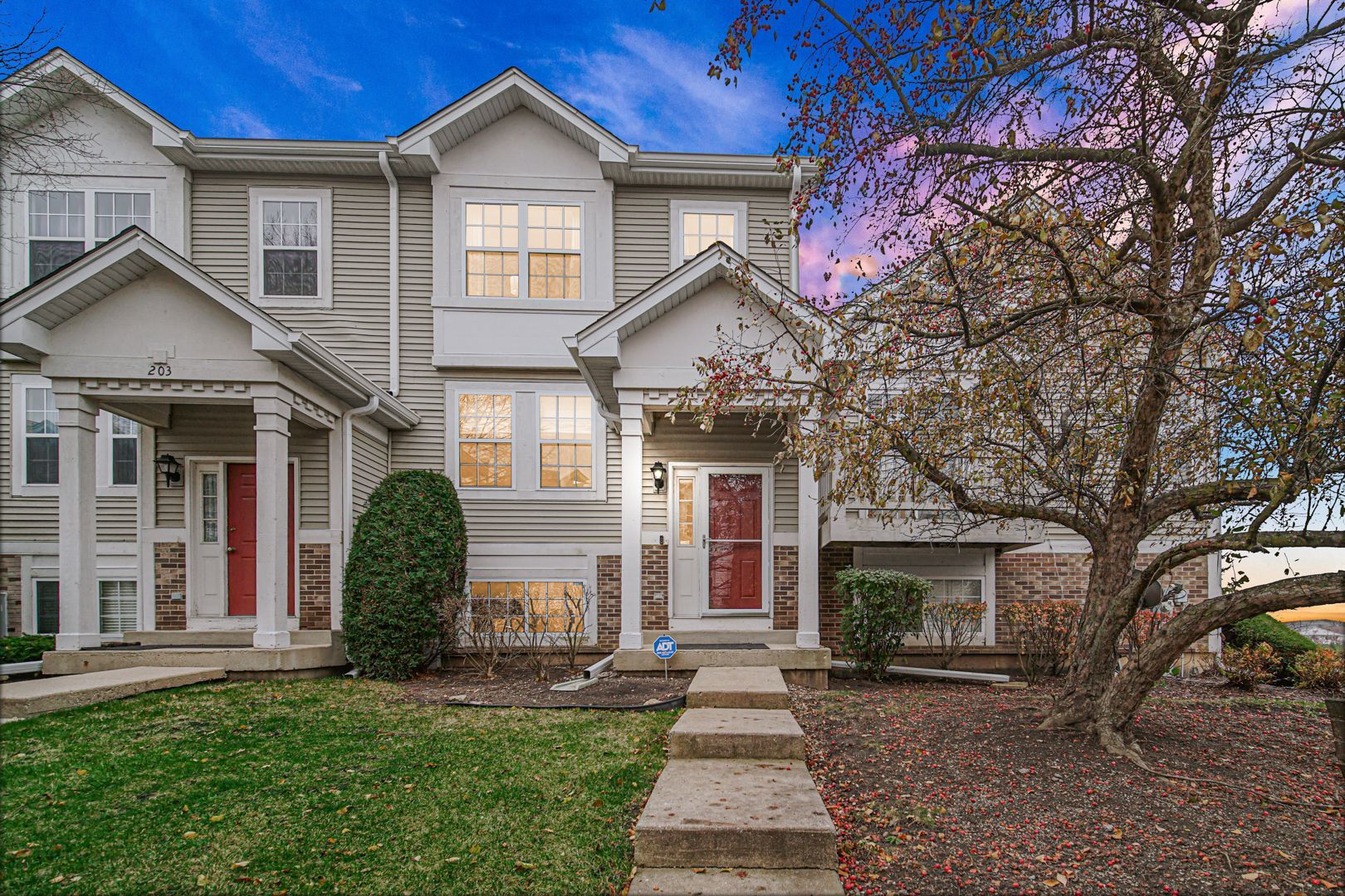 front view of a house with a yard