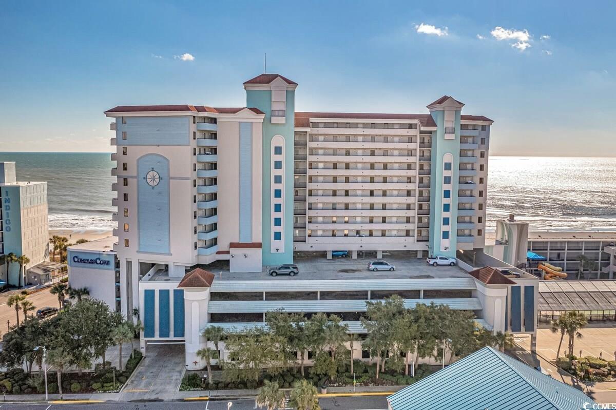 View of building exterior with a view of the beach