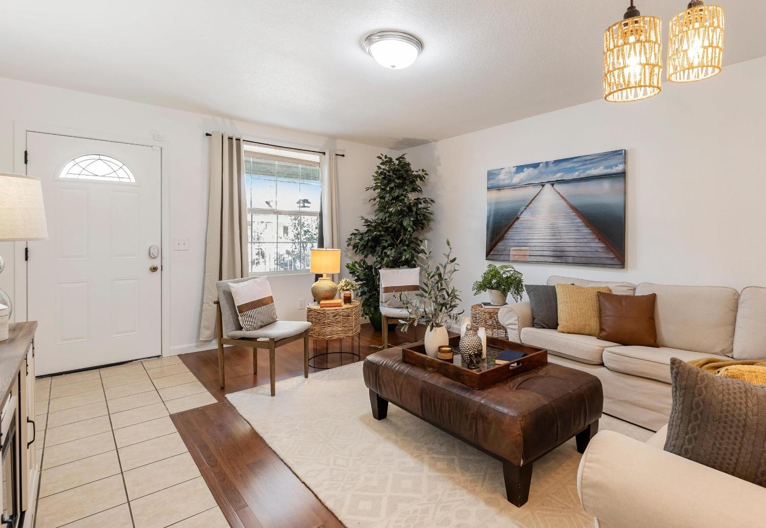 a living room with furniture and a rug