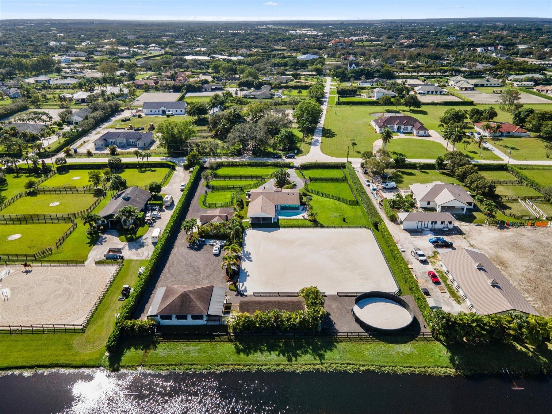 an aerial view of a pool yard residential house and ocean view