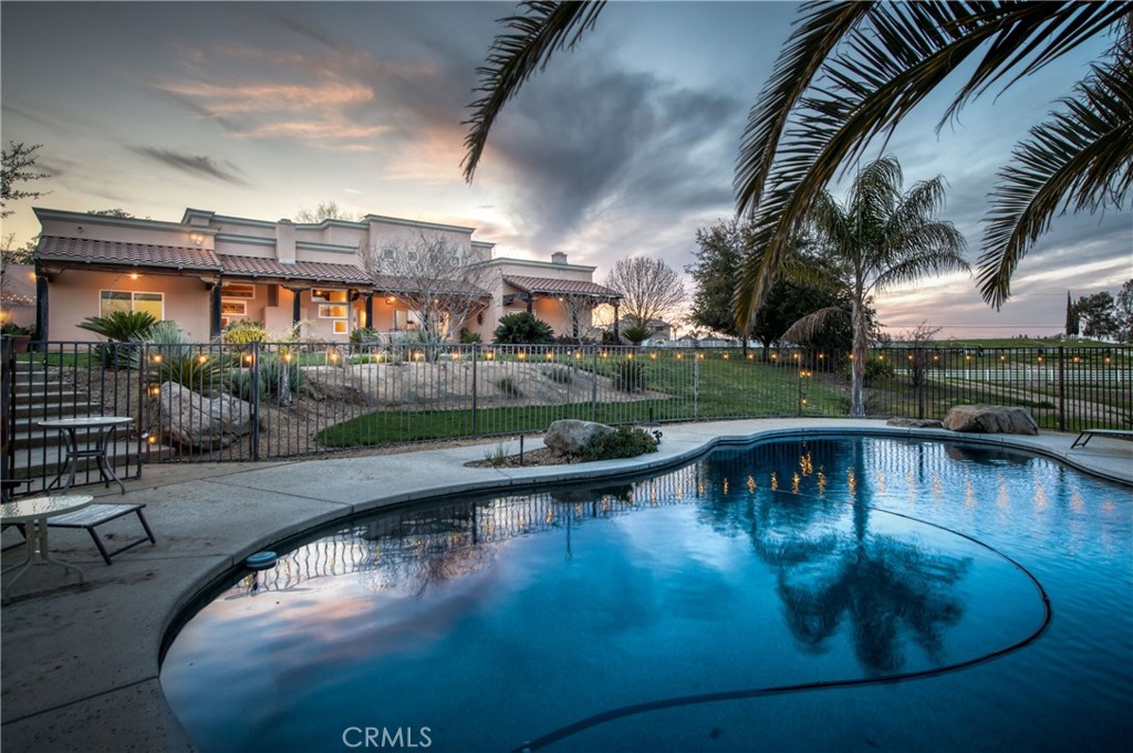 a view of a swimming pool with a patio