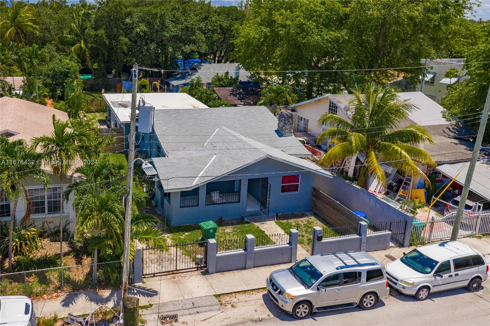 an aerial view of a house with a yard balcony