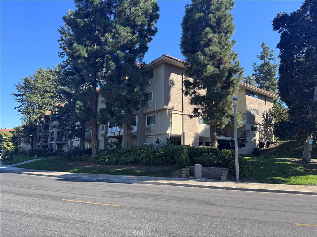 a house that has a tree in front of it