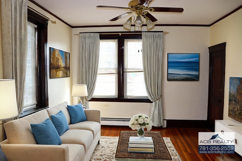 a living room with furniture and a window