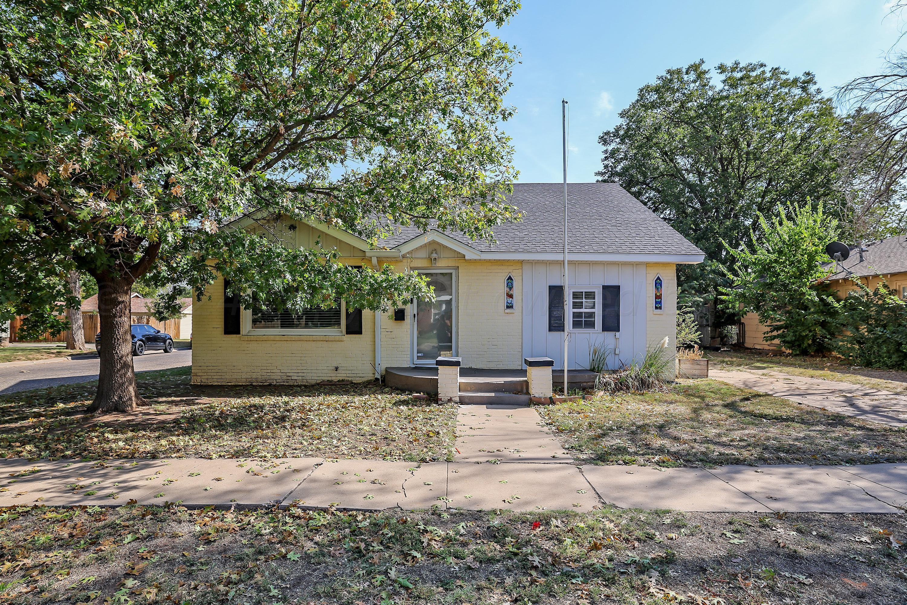 a house with yard in front of it