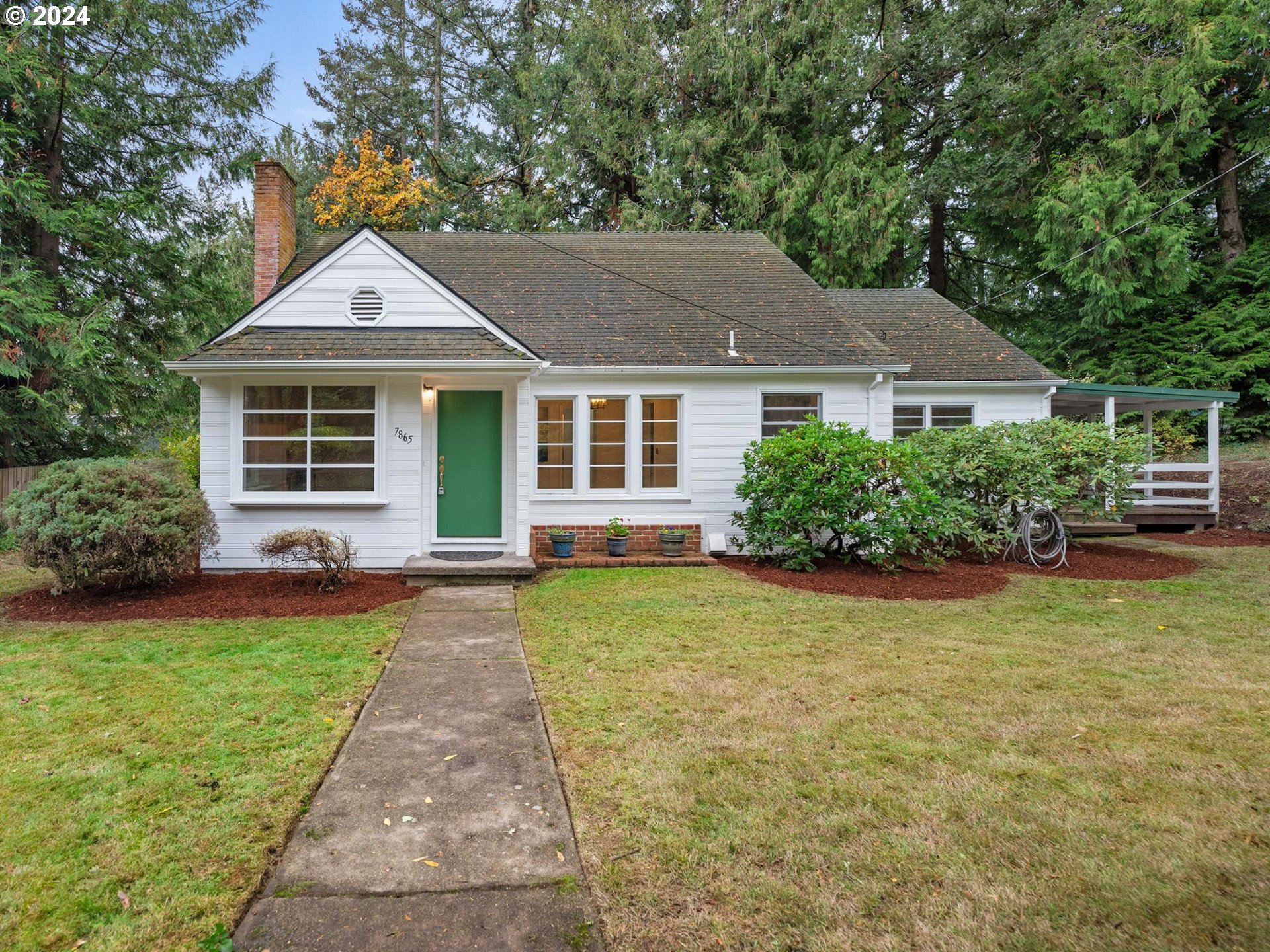 front view of a house with a yard