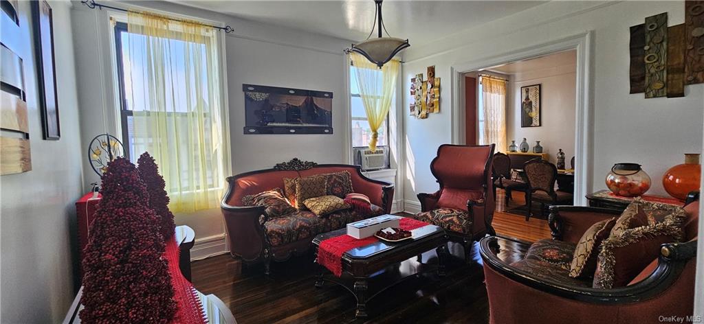 a living room with furniture and a mirror