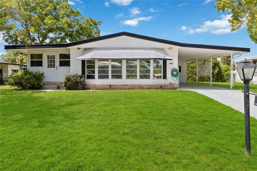 front view of a house with a yard