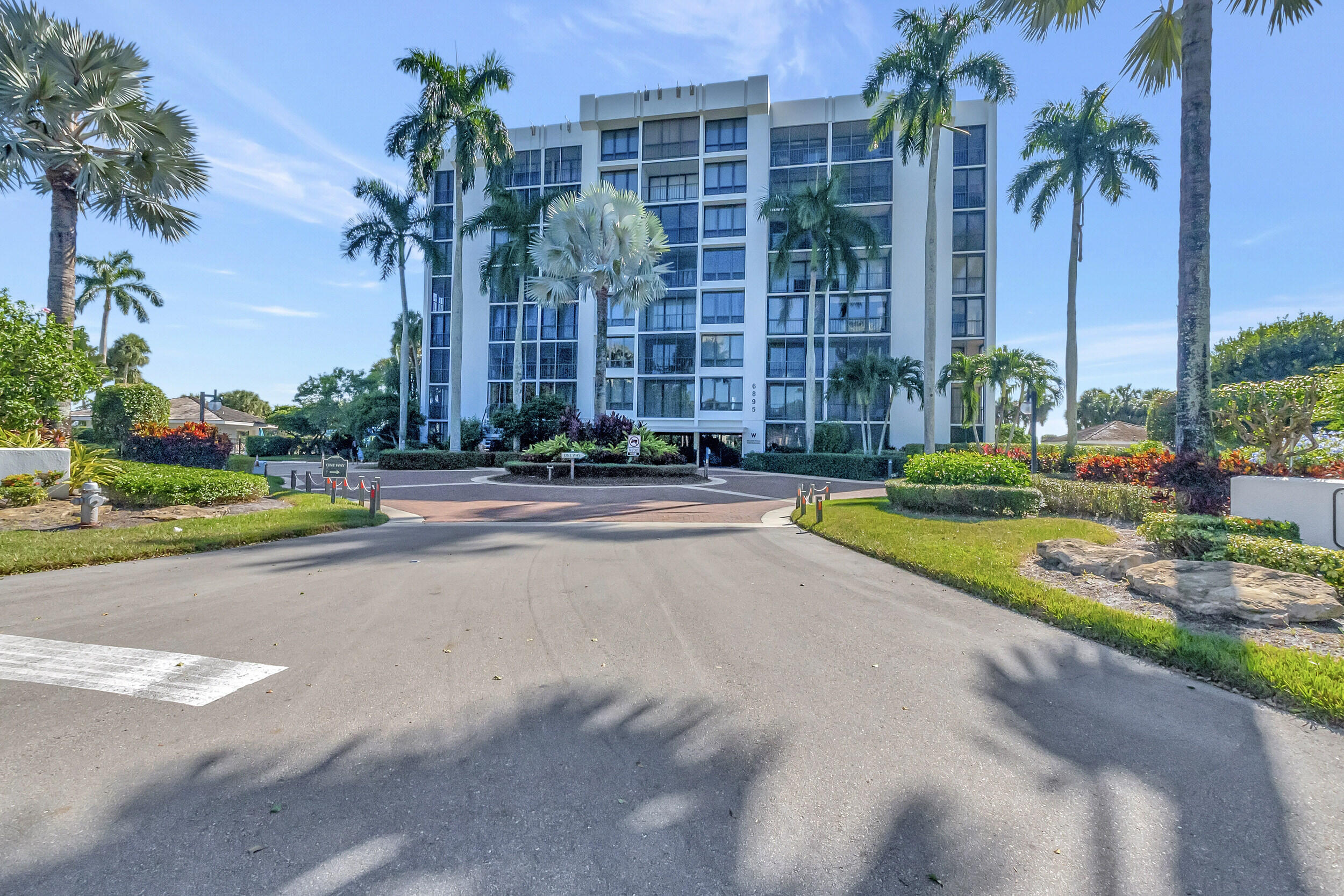 a building with palm trees in front of it