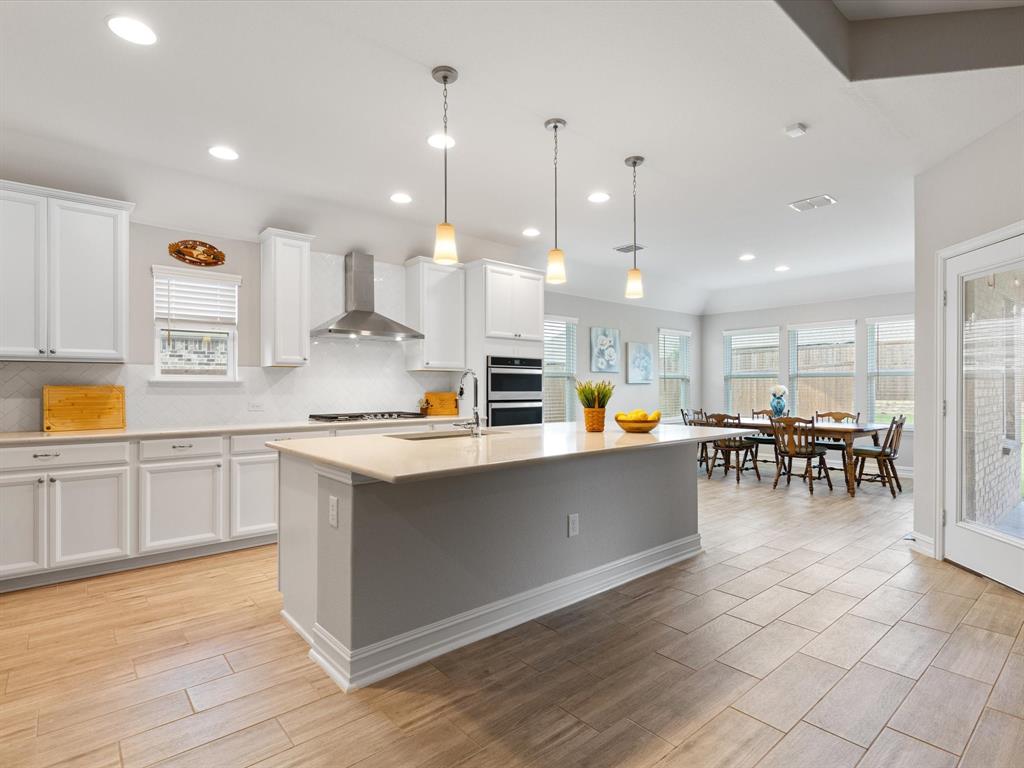 a kitchen with lots of counter space and appliances