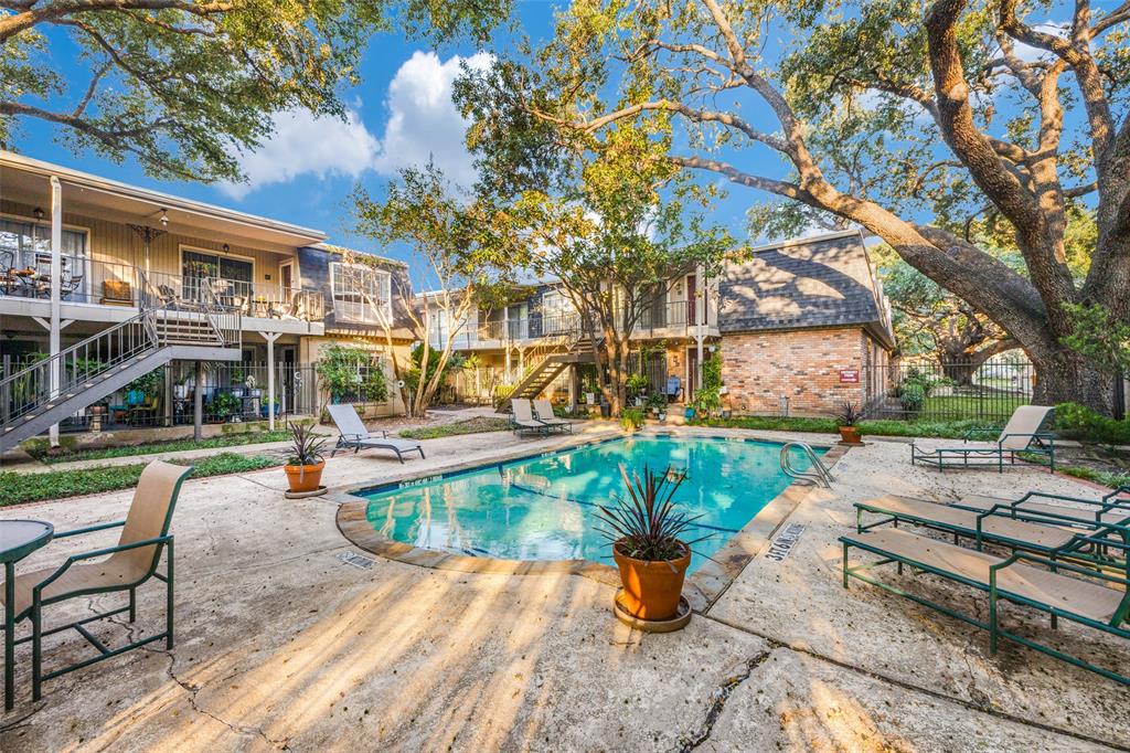 a view of a swimming pool with a patio