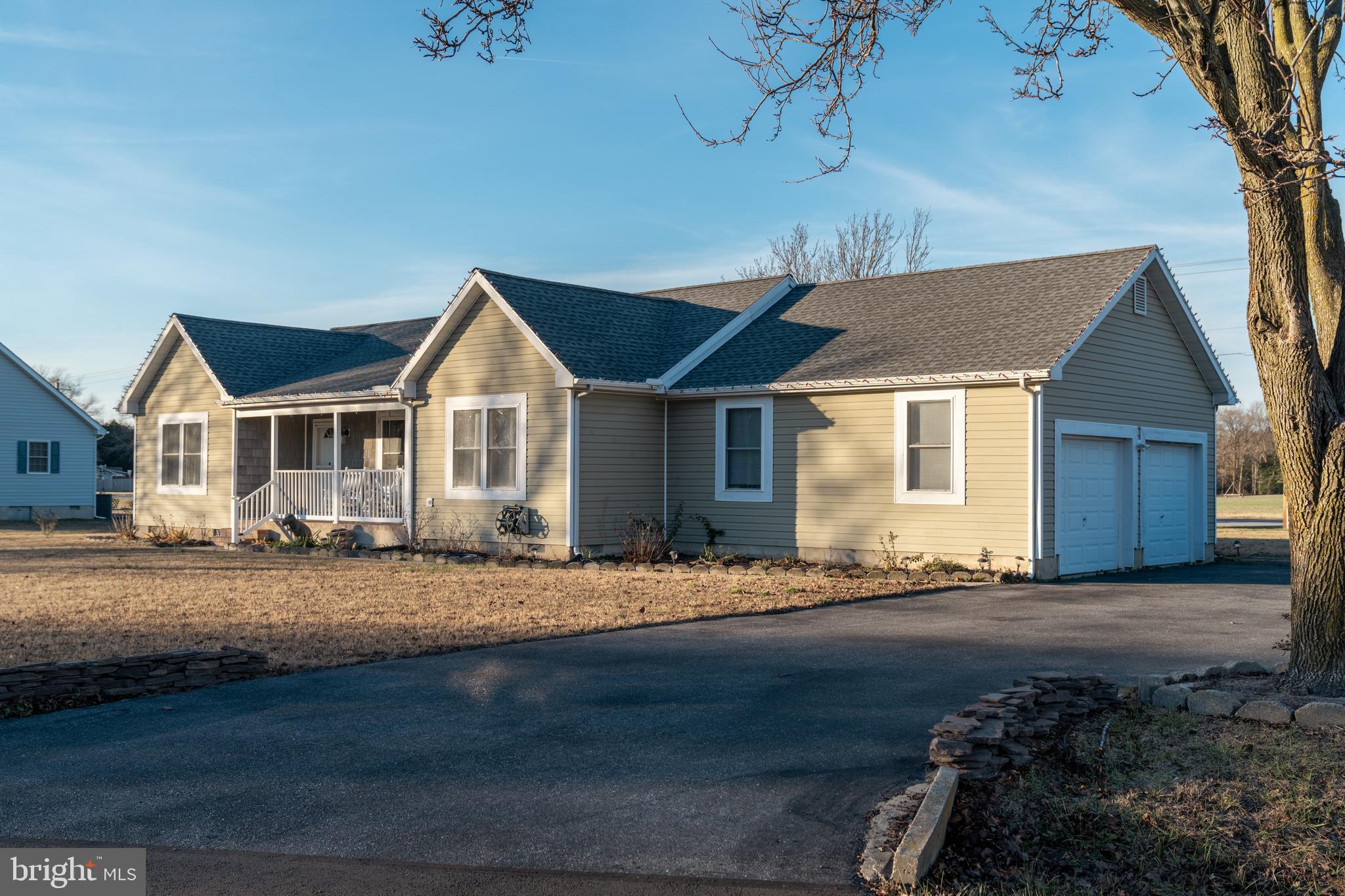 Side load 2 car garage with large driveway