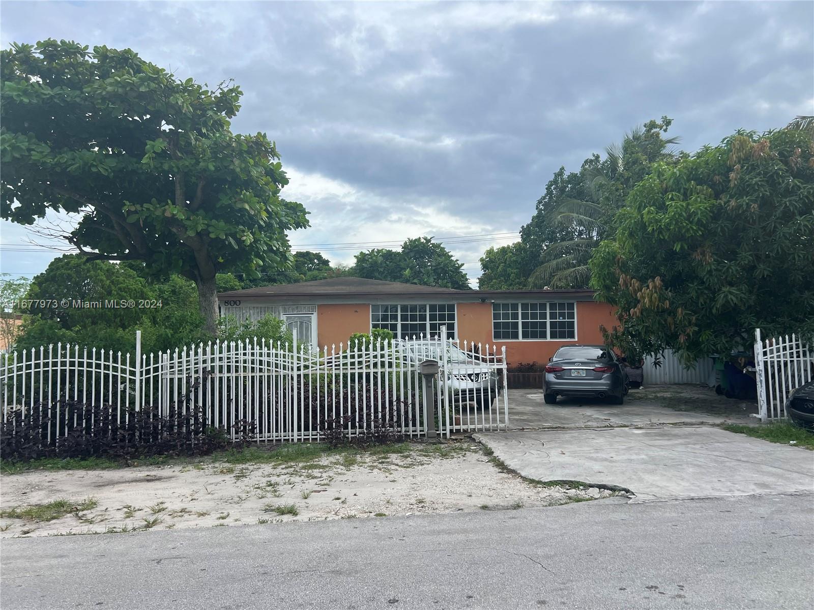 a view of a bench next to a yard