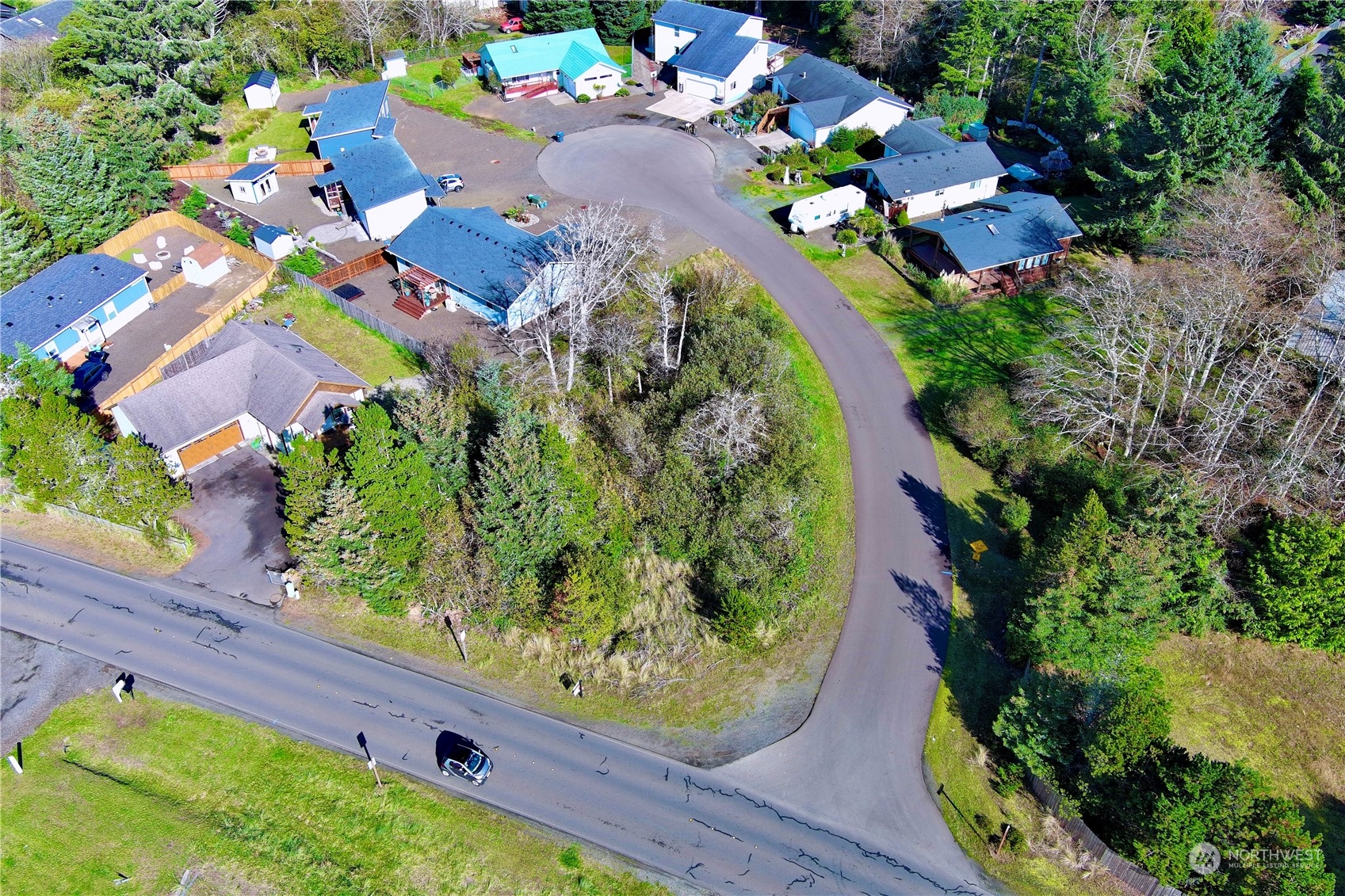 an aerial view of a house with a garden and swimming pool