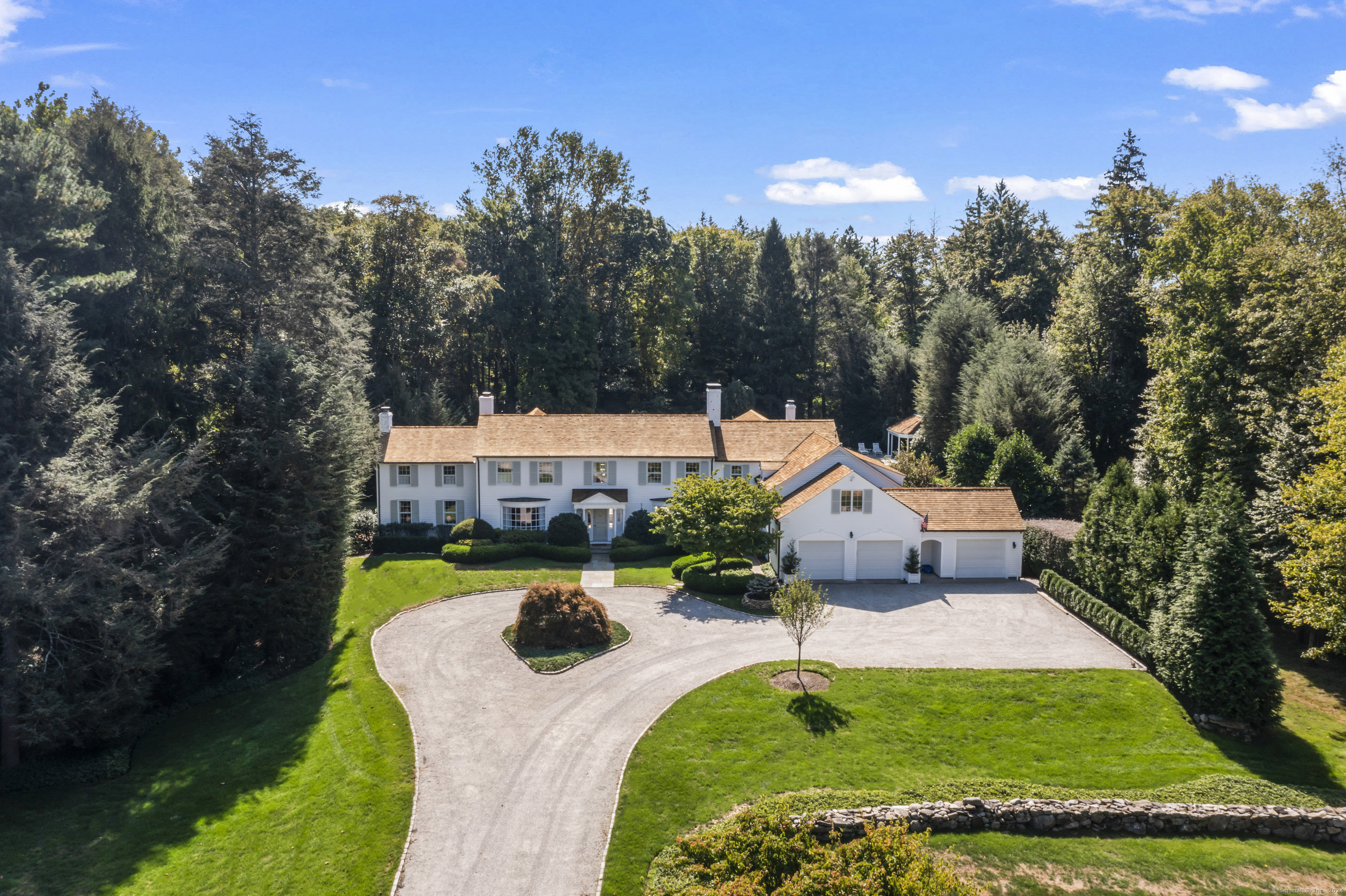 aerial view of a house with swimming pool garden and patio