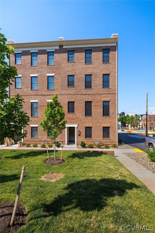 a large building with a yard in front of it