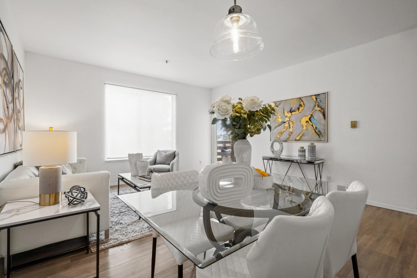 a living room with furniture and a chandelier