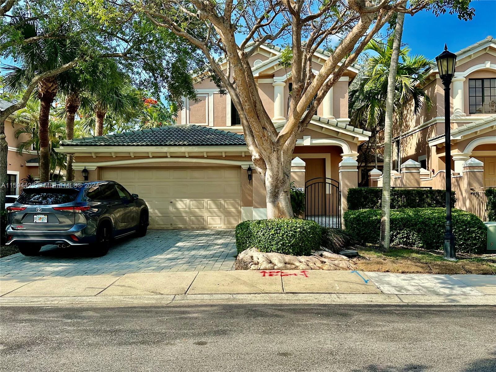 a front view of a house with a yard